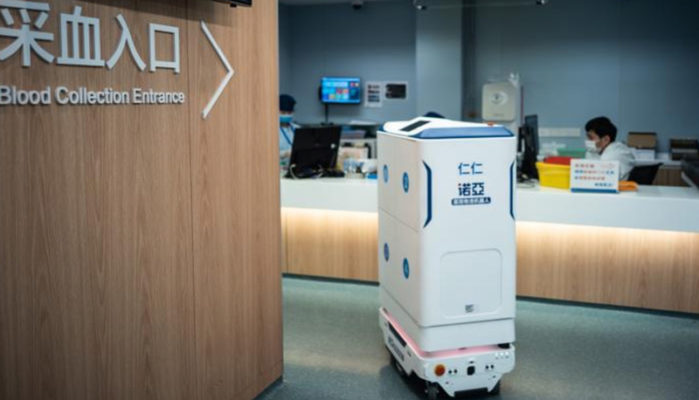 A mobile robot delivers medicine and meals to patients in healthcare facilities.